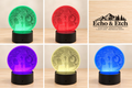 Santa and Mrs. Claus engraved acrylic LED light showing five color modes